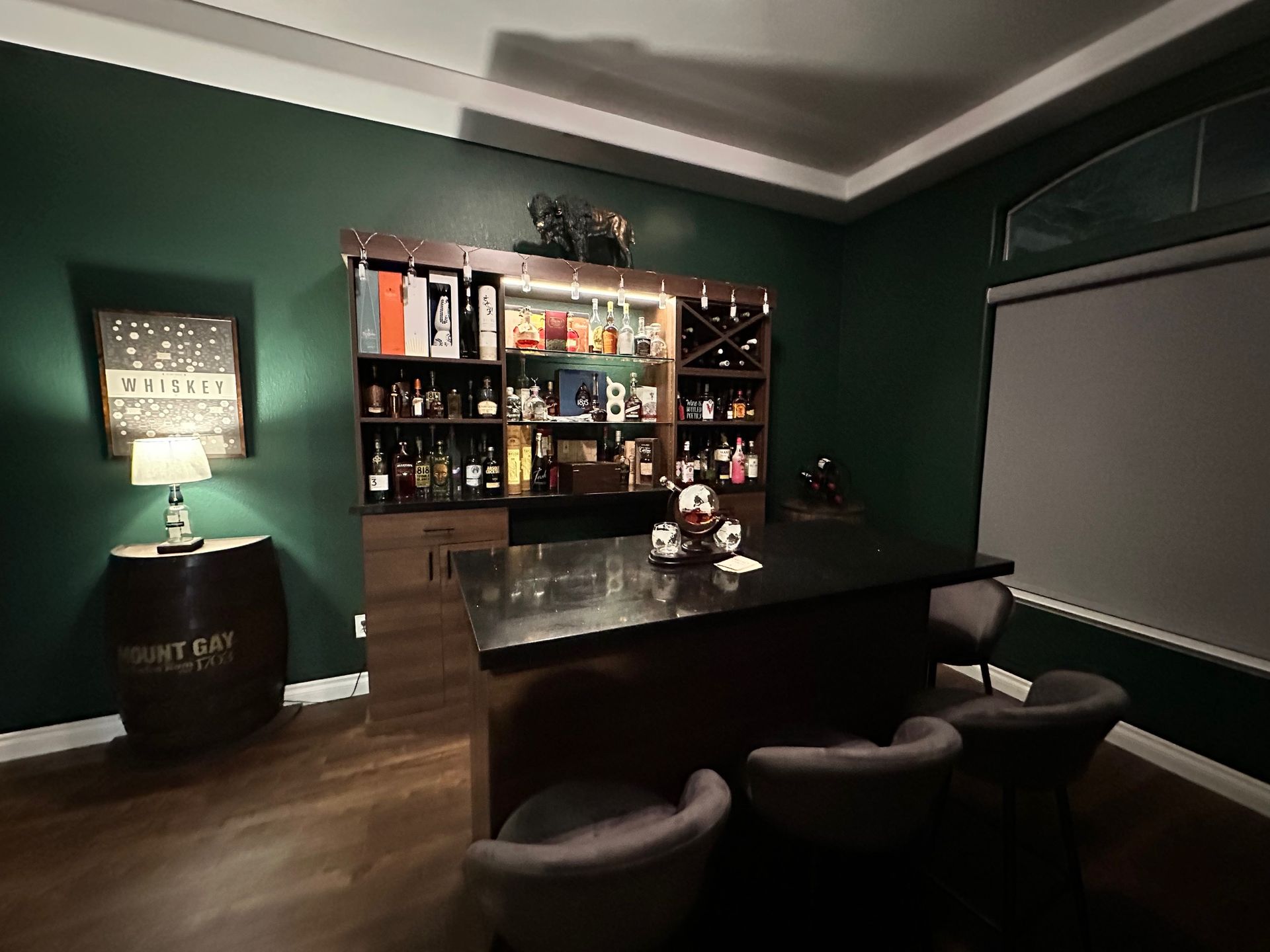 Custom black quartz bar top and back bar built by The Countertop Shop