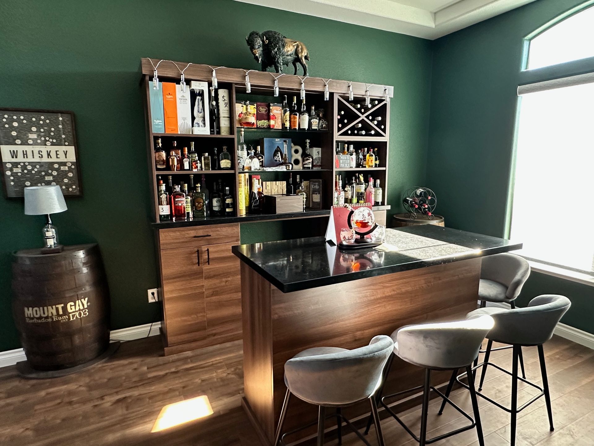 Custom home whiskey room bar with quartz top
