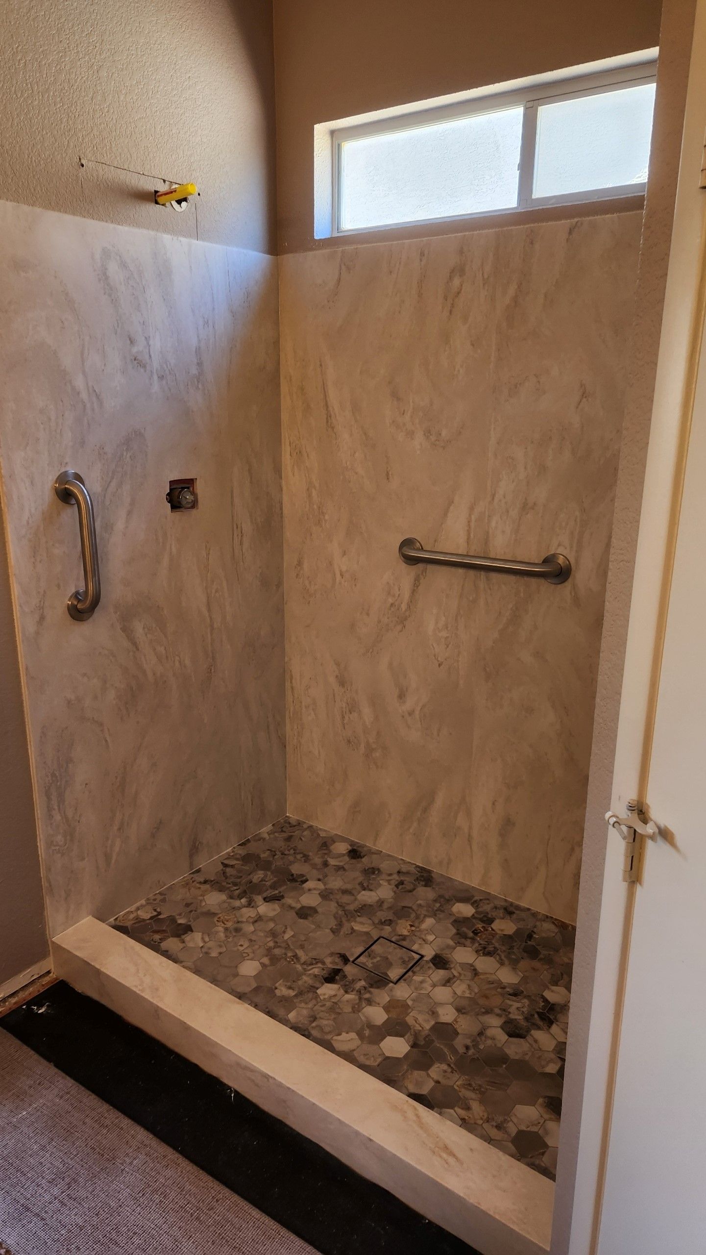 Solid surface shower surround installation