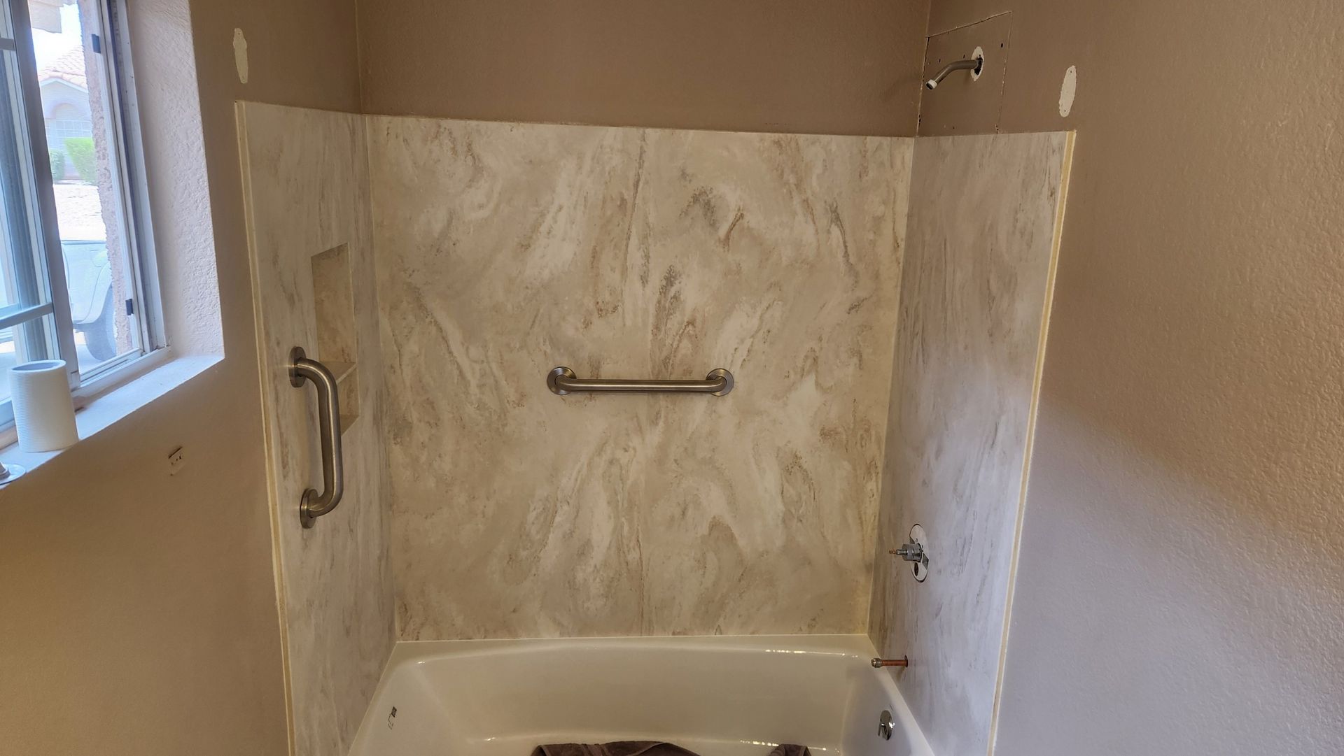 Solid surface tub surround installation